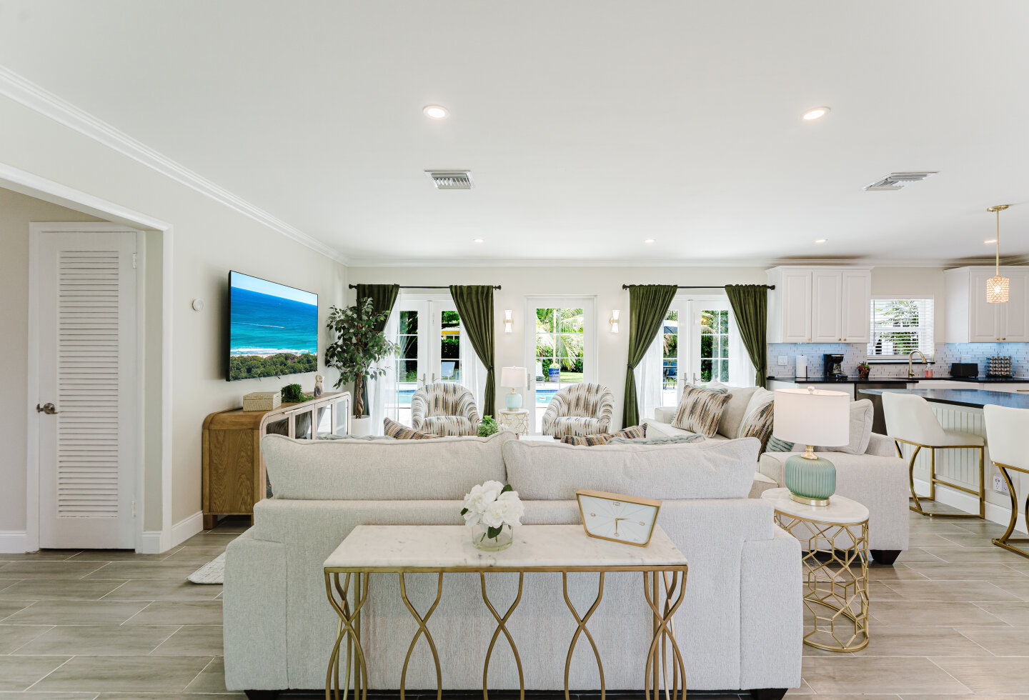Living room opening to the pool