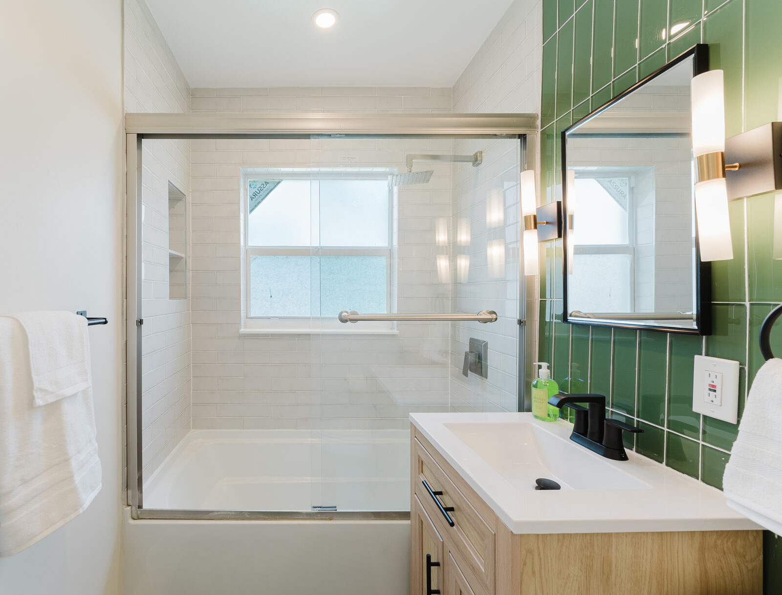Bathroom with green tile accents