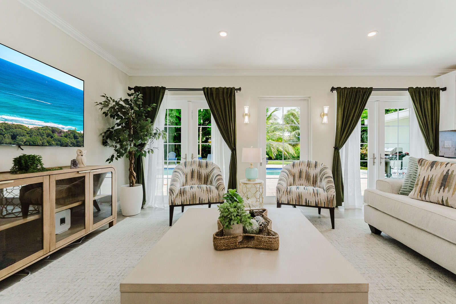 Open living room with views to the pool